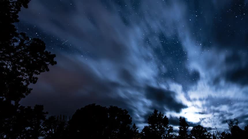 Clouds flowing across the night sky