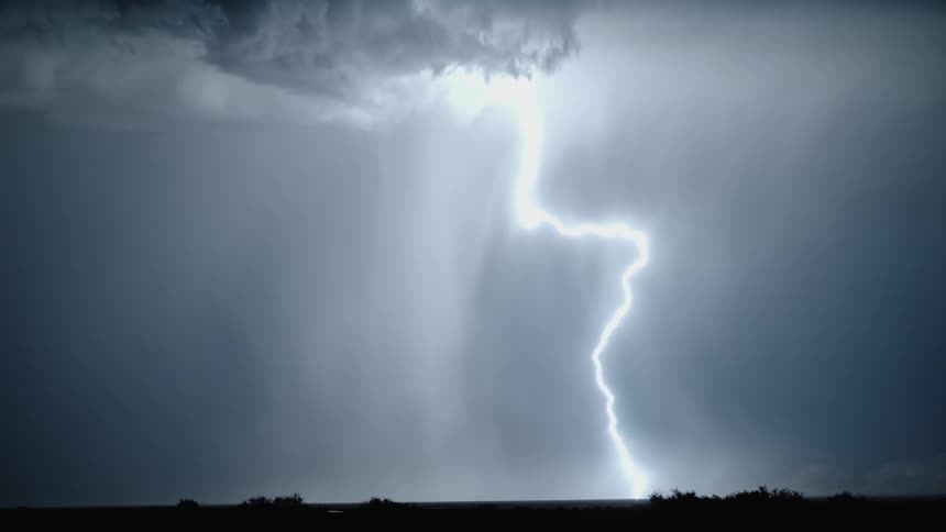 Flash lighting and a storm in the night sky