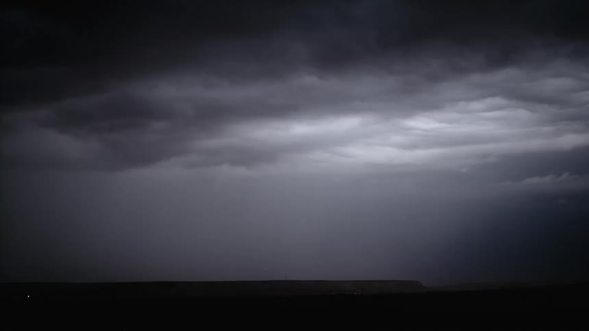 Lightning shoots from the clouds at night