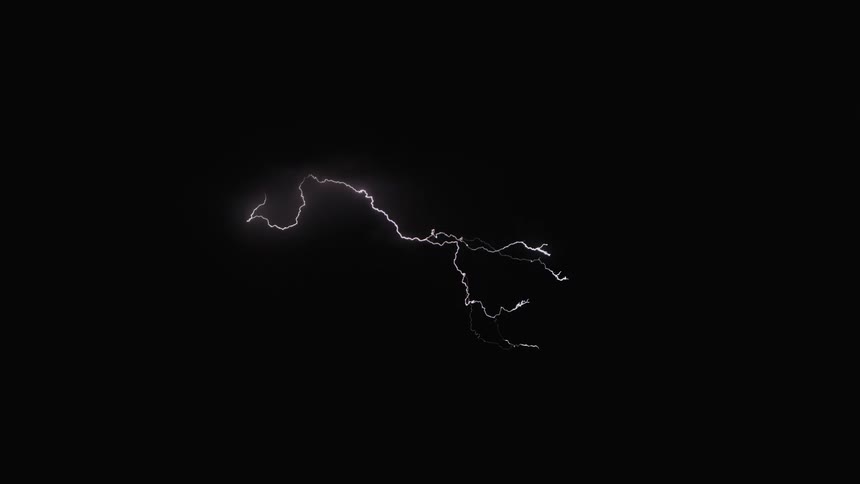 Lightning cracks across the darkness of the night sky and illuminates the clouds with flashes of light