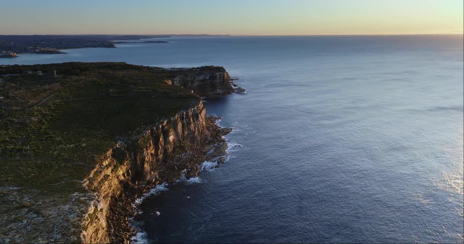 A coastal cliff face at dusk