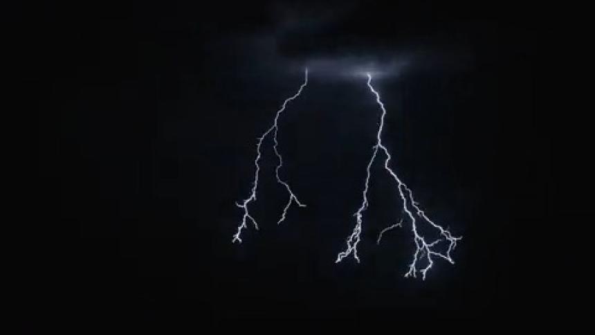 Lightning and a tornado in the night sky