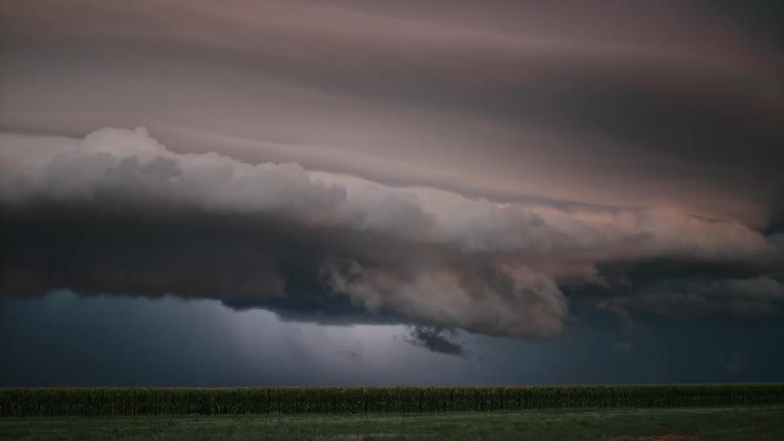 Storm clouds and lightning over a field
