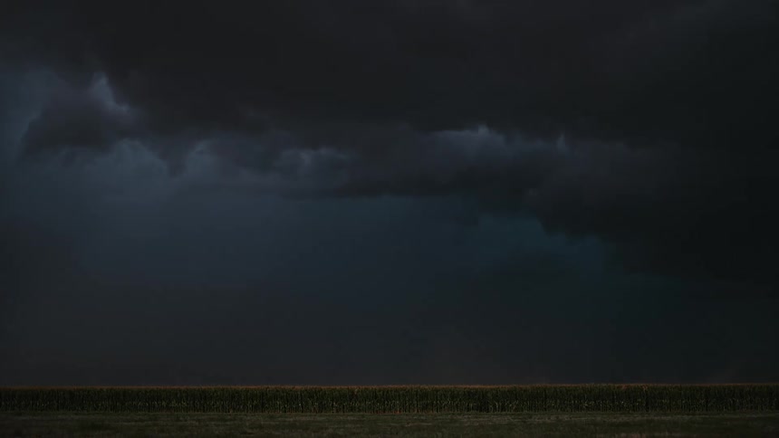 A dark stormy sky with a lot of lightening
