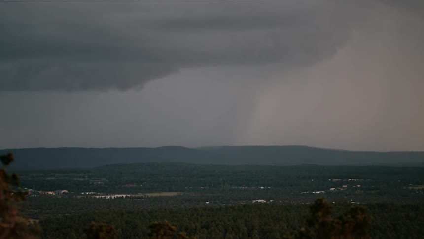 A lightning storm coming out of a huge black cloud and crashing to the ground