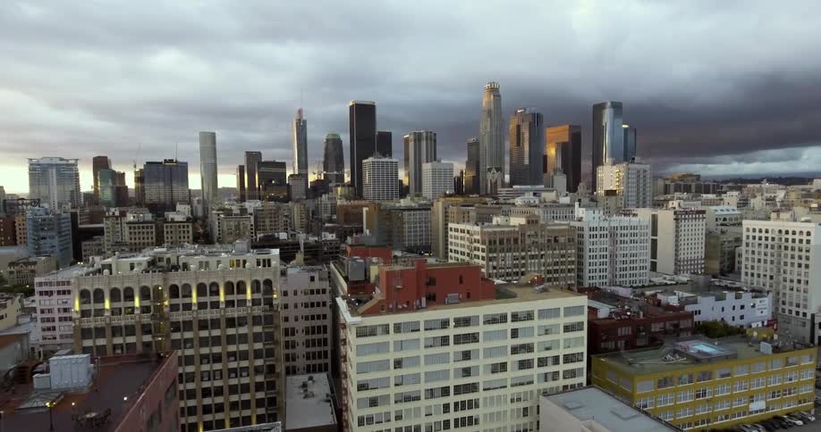 The city has tall buildings on a cloudy day