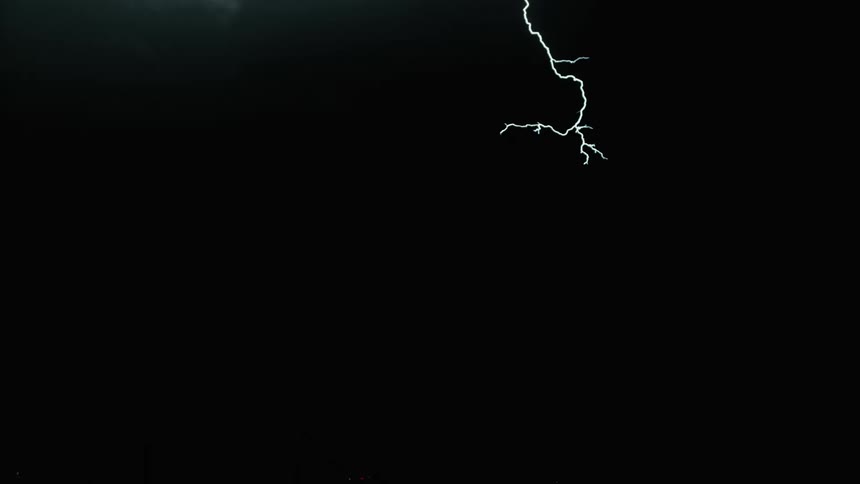 Lots of bright lightning ripping through the dark sky