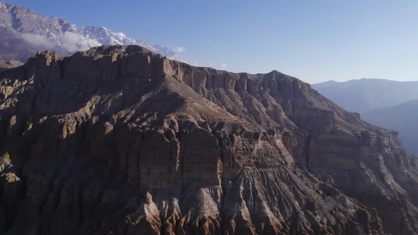 The mountain top on a clear sunny day with rough sloppy terrain