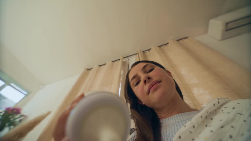 A mother feeding her baby with a bottle