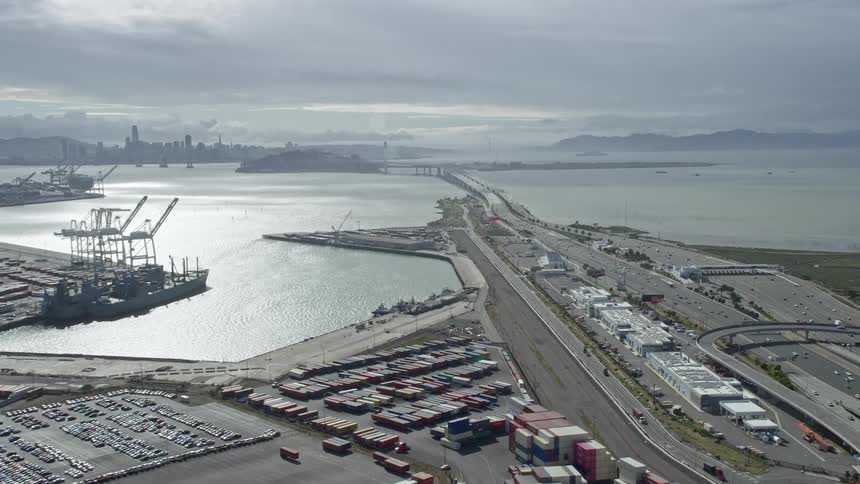 Approaching the Bay Bridge and 80 freeway in Oakland California on a cloudy day with light traffic