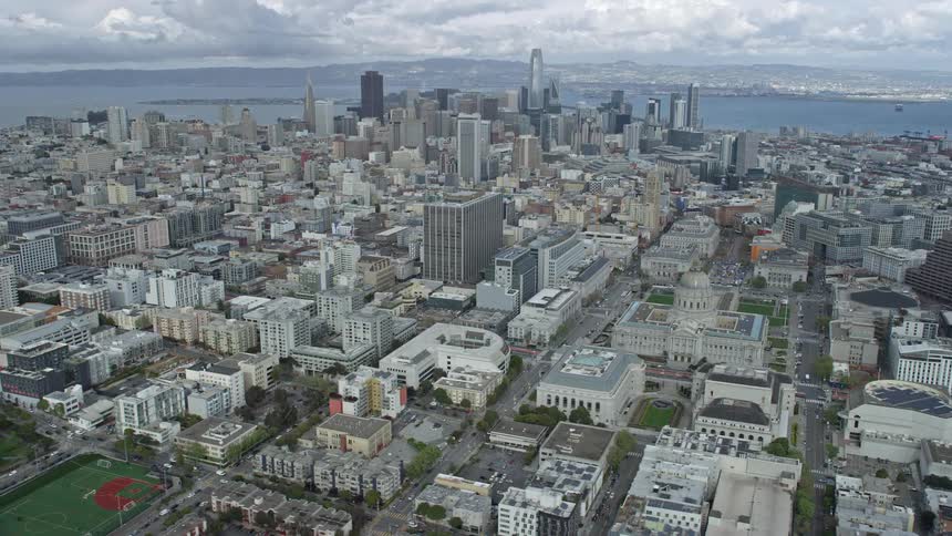  aerial footage of San Francisco's city skyline including the iconic city hall on a cloudy day