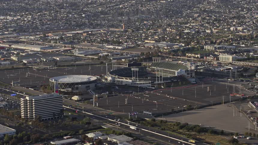  aerial footage showcasing the bustling arena and stadium in sunny Oakland California during a vibrant day capturing the essence of sports entertainment and the lively atmosphere of the city in Northern California's Bay Area