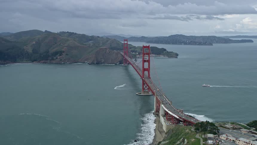 Drone captures stunning aerial view of foggy Bay Area as it flies through clouds to reveal the iconic Golden Gate Bridge in San Francisco California