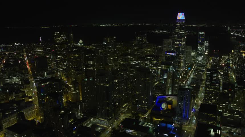 Approaching Downtown San Francisco skyscrapers at night capturing the clear skies and stunning wide-angle view of the city's high-rise superstructures