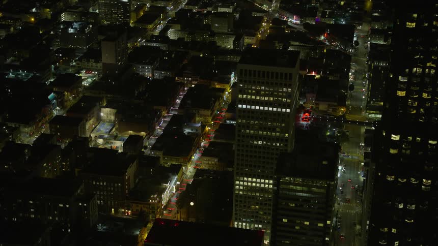 A mesmerizing aerial view of San Francisco's Grant Ave in Chinatown at night showcasing the stunning skyscrapers and bustling city streets