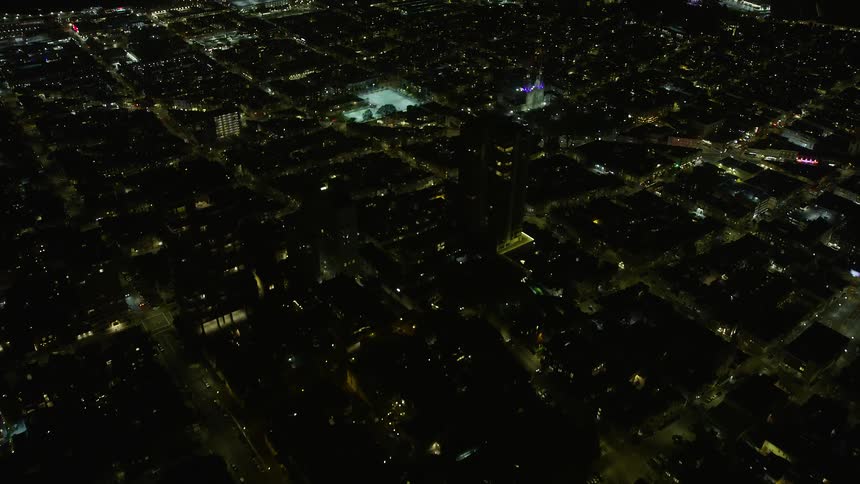  aerial footage of a nighttime flyover above Russian Hill apartment buildings in San Francisco showcasing the city's residential area under clear skies