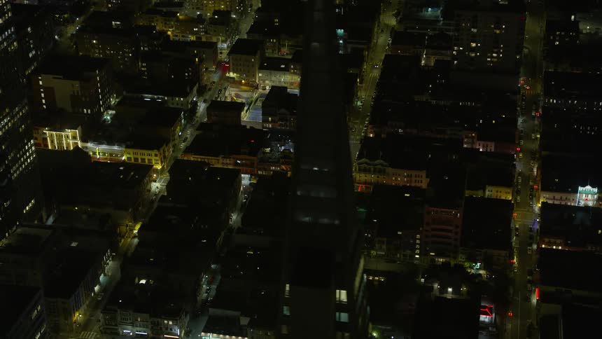 A stunningaerial footage revealing the vibrant Chinatown office and apartment buildings at night in San Francisco California showcasing the city's bustling industry and residential areas under clear skies