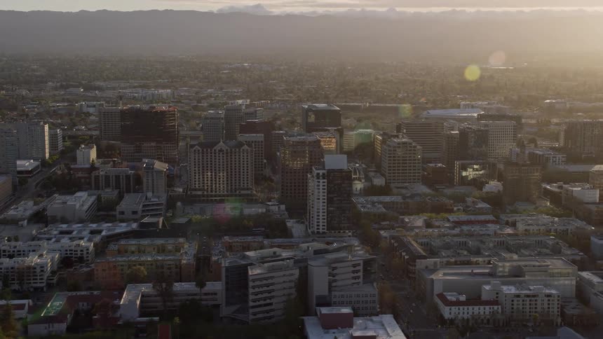 anaerial footage capturing the mesmerizing sunset over the office buildings in downtown San Jose California during the summer