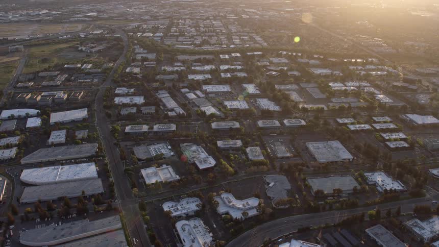 an aerial view of warehouse and office buildings at sunset in San Jose California showcasing the industrial and vibrant cityscape of the Bay Area