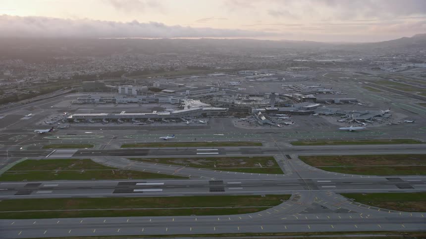  aerial footage of an sunset approach to San Francisco International Airport showcasing the stunning scenery of the Bay Area California