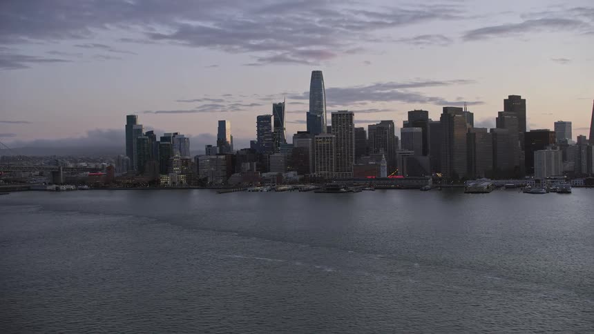 an aerial view of the Downtown San Francisco skyline at twilight showcasing the city's high-rise buildings and vibrant cityscape