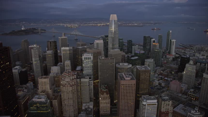 an aerial view of San Francisco's downtown skyscrapers at twilight showcasing the city's impressive high rises against a partly cloudy sky