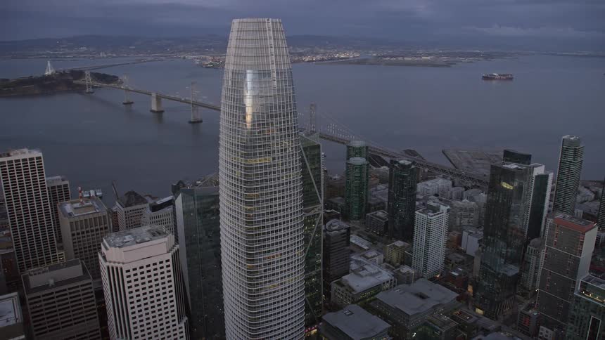 Aerial footage of Salesforce Tower in Downtown San Francisco at twilight showcasing the high-rise buildings and cityscape of San Francisco Bay Area