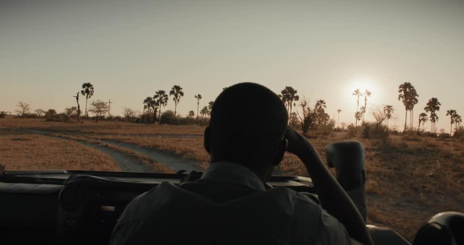 A man rides off road in the car