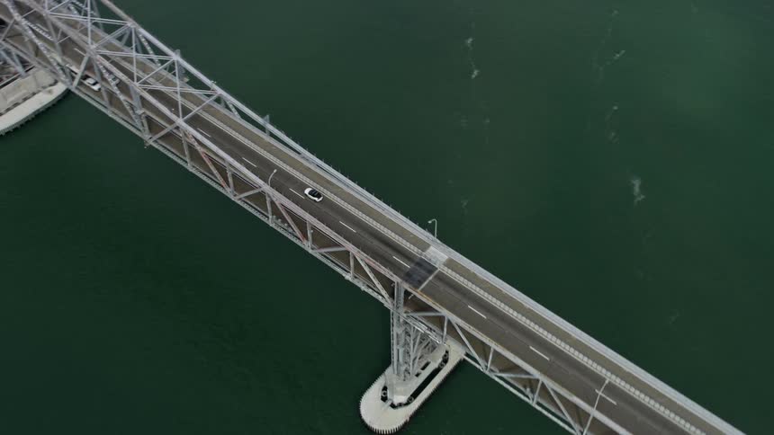 Tracking a white car on the Richmond Bridge in California during the day