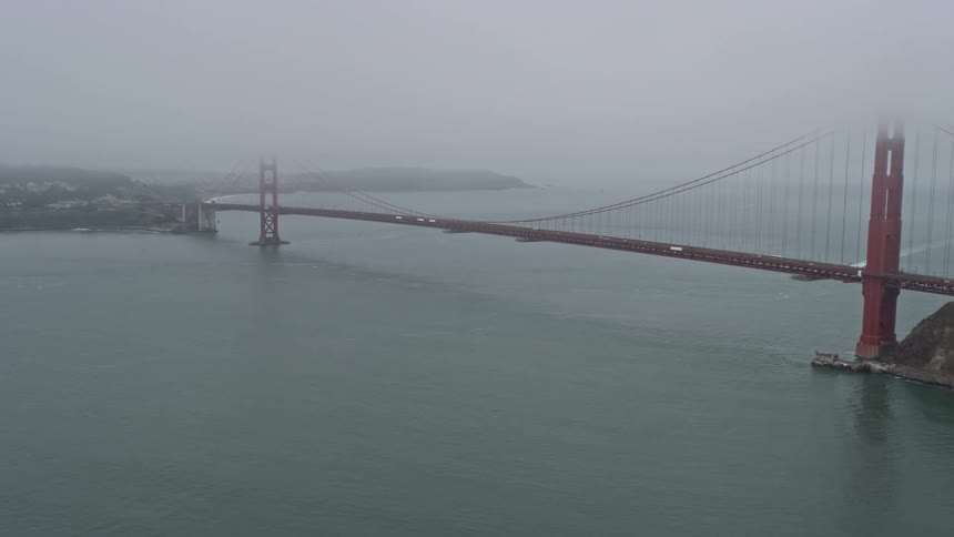 Passing by the iconic Golden Gate Bridge on a foggy day in San Francisco California