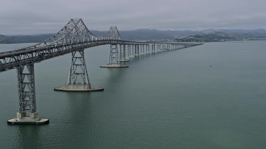 Aerial footage of the Richmond Bridge showcasing the large span and light traffic during the day in the Bay Area of California