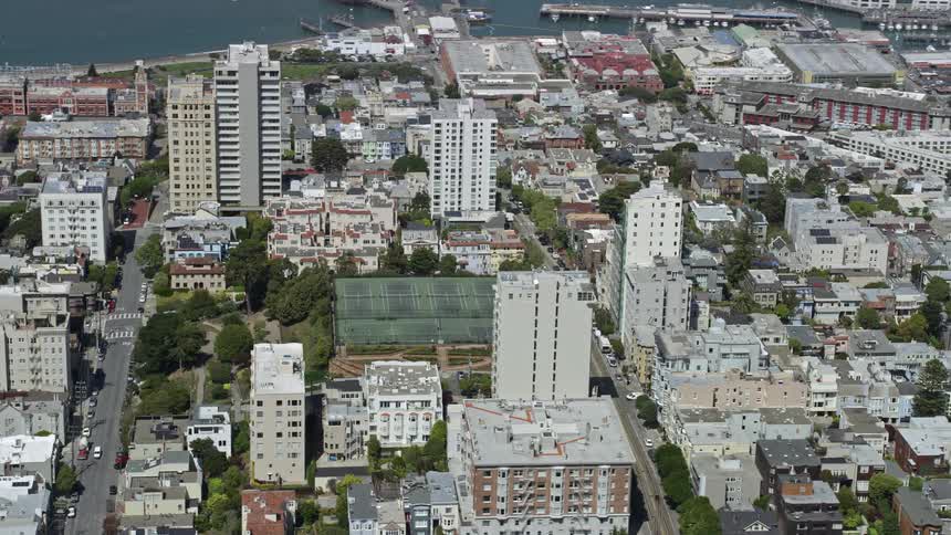  aerial footage of tennis courts in Russian Hill San Francisco California showcasing the city's sunny daytime atmosphere in George Sterling Park