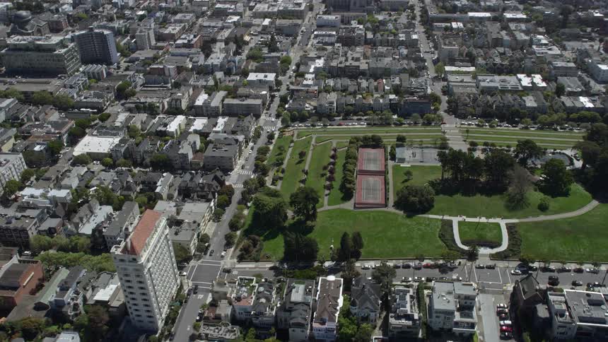 Aerial footage of tennis courts in Pacific Heights San Francisco showcasing the vibrant city park during a sunny day in Northern California