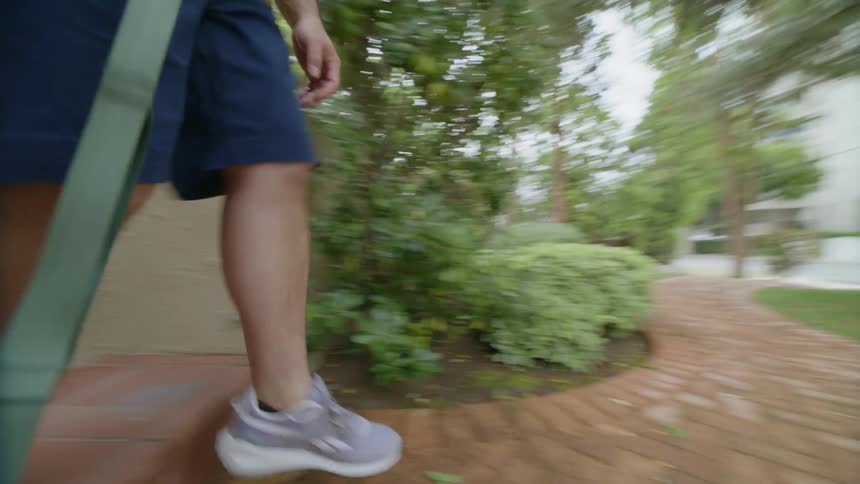 Man walking and holding an animal leash
