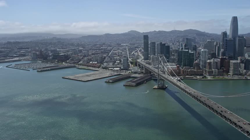  aerial footage showcasing a stunning view of the South of Market and Downtown San Francisco seen from the iconic Bay Bridge in California