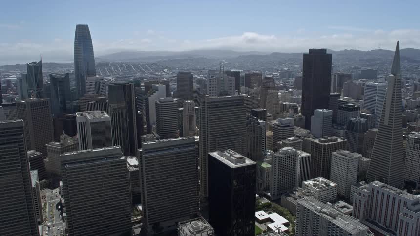 an aerial view of the vibrant Downtown San Francisco skyscrapers and cityscape during a sunny day in Northern California showcasing the beauty of the Bay Area from a high-rise perspective