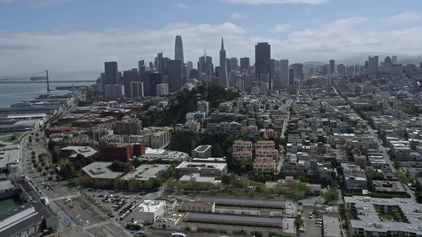  aerial view of downtown San Francisco California including Pier 39 Coit Tower and the vibrant cityscape captured during a sunny day in the Bay Area