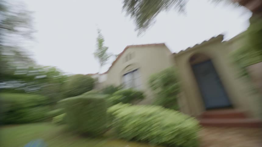 Man swinging a ball and then playing on the lawn