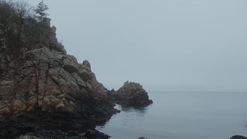 Coastal island skyline with rocky stones