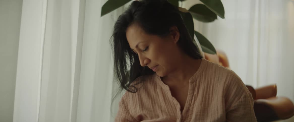 Woman breastfeeding her child