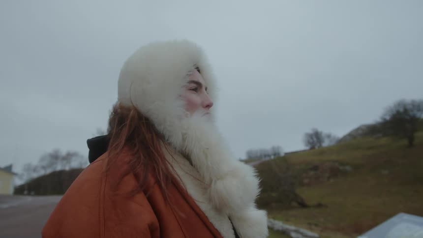 Woman wearing winter clothes admiring the scenery