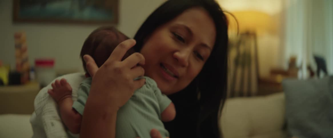 Mother giving her baby a kiss and hugging him