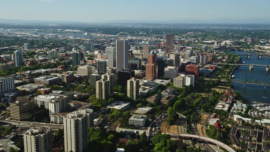 an aerial view of downtown Portland Oregon showcasing the city's impressive skyscrapers and high-rises