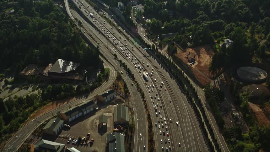 Aerial flyover of heavy highway traffic in Northwest Portland Oregon during daytime