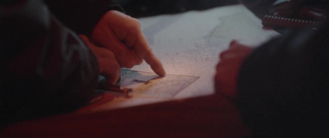 A person is pointing to parts of a map