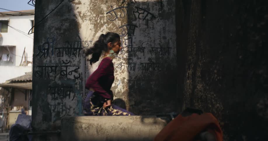 A woman goes into the home