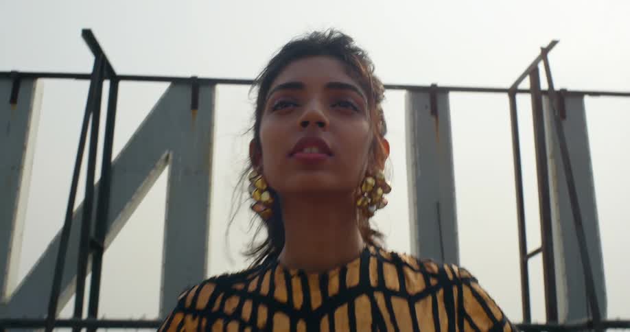 A model poses on a downtown rooftop