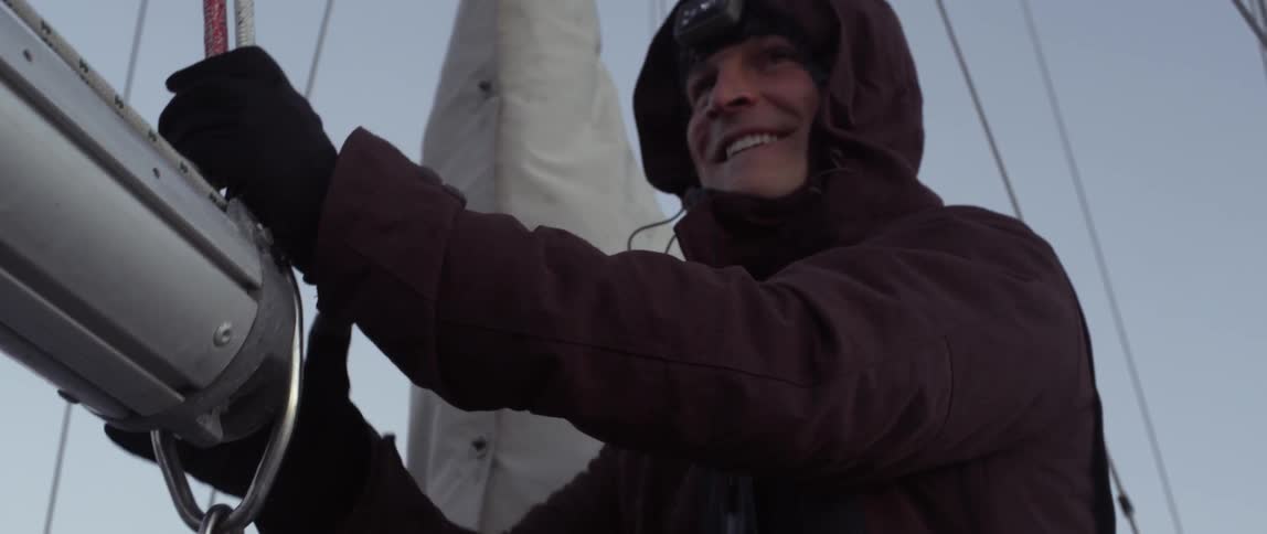 A man is smiling on a ship