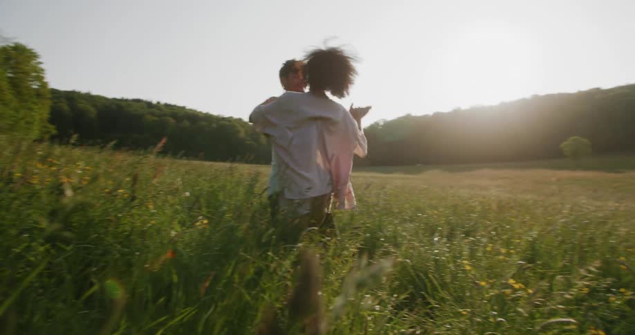 Couple Dancing in a meadow on a sunny day couple dancing summer