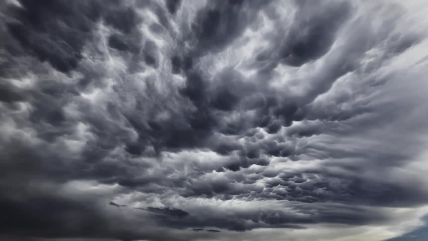 Heavy storm clouds move through the sky